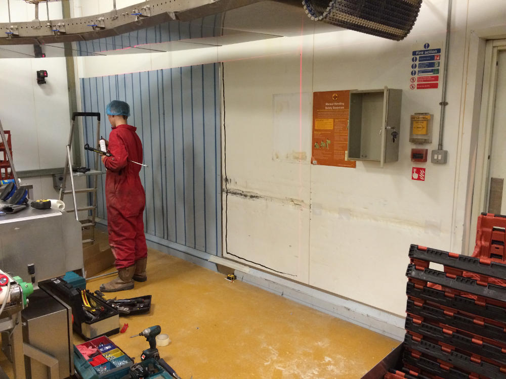 Impact damage to wall in packing area